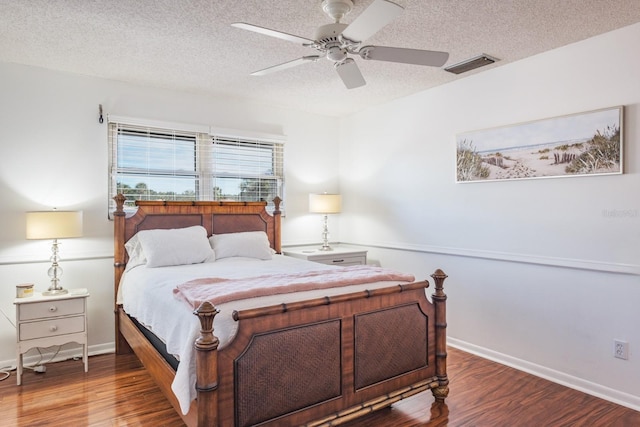 bedroom featuring ceiling fan, a textured ceiling, and hardwood / wood-style flooring