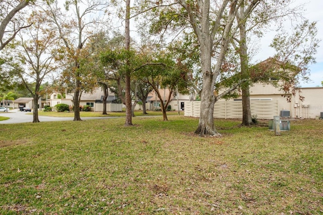 view of yard featuring central air condition unit