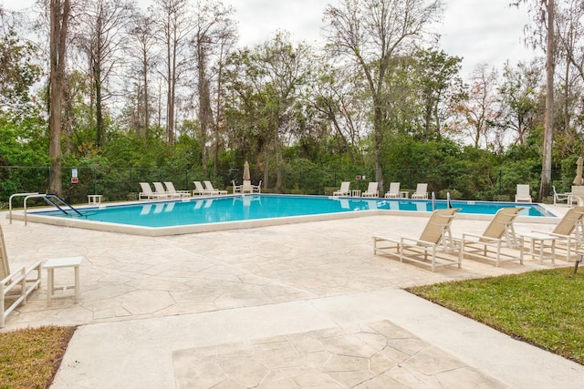 view of swimming pool with a patio area