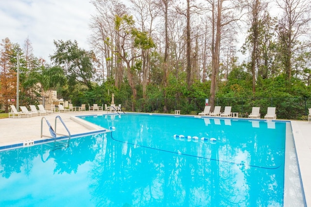 view of pool featuring a patio