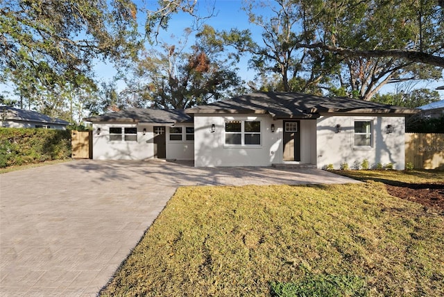 ranch-style home with a front yard