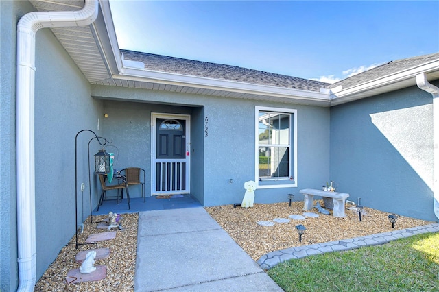 doorway to property featuring a patio area