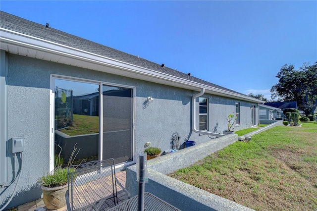 view of home's exterior featuring a lawn