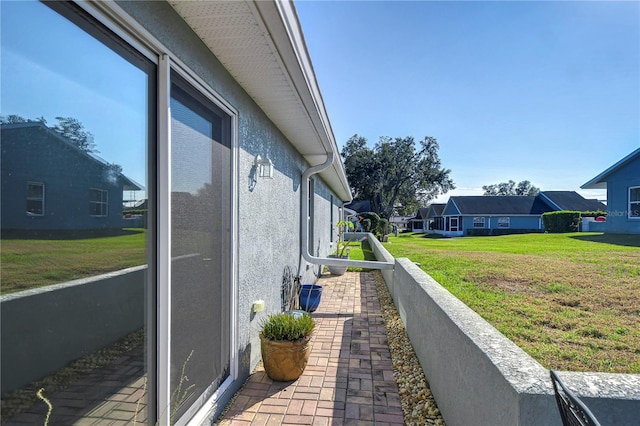 view of side of home featuring a yard