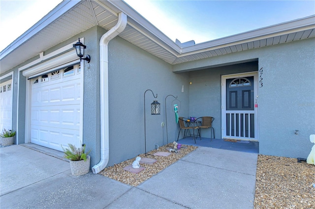 view of exterior entry featuring a garage