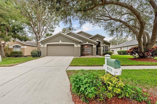 view of front of home featuring a front lawn and a garage