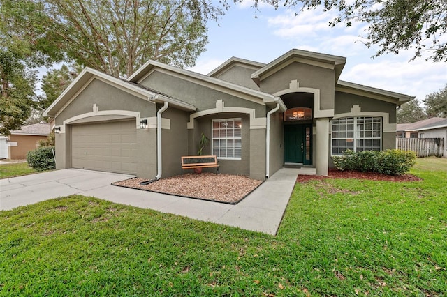 view of front of house featuring a front lawn and a garage