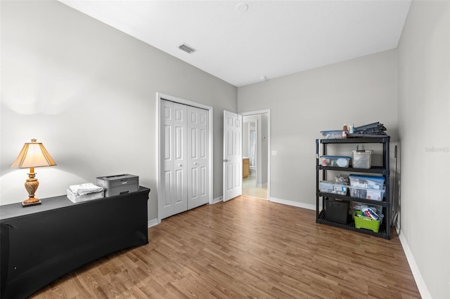 home office featuring hardwood / wood-style flooring