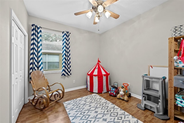 rec room featuring ceiling fan and wood-type flooring