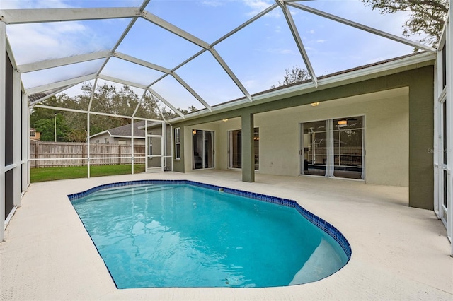 view of swimming pool with a lanai and a patio