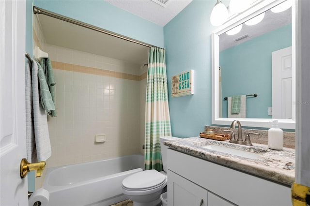 full bathroom featuring toilet, vanity, shower / bath combination with curtain, and a textured ceiling