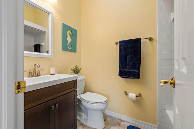 bathroom with tile patterned flooring, toilet, vanity, and walk in shower