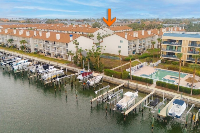 birds eye view of property featuring a water view