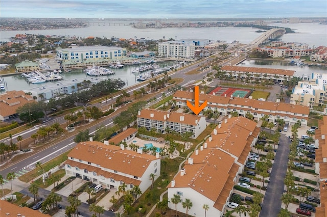 birds eye view of property with a water view