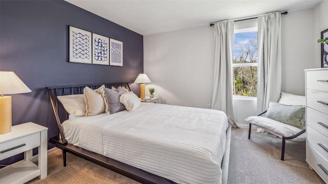 bedroom featuring light colored carpet