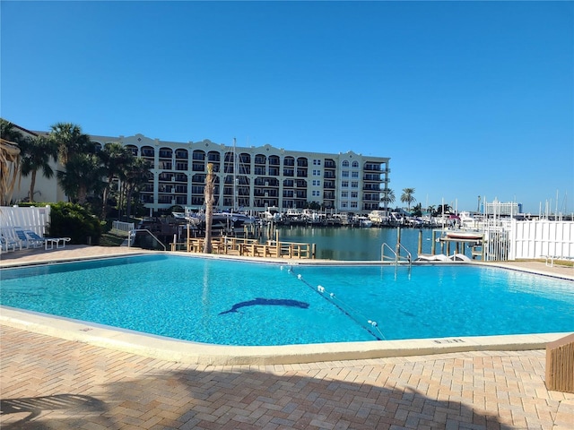 view of pool featuring a water view