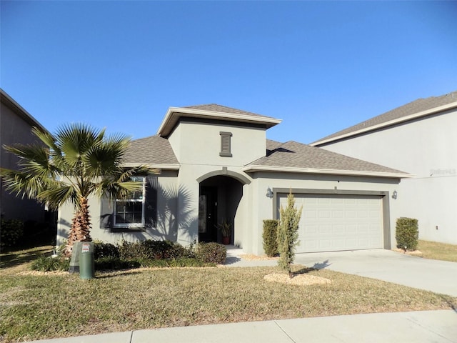 view of front facade featuring a front lawn and a garage