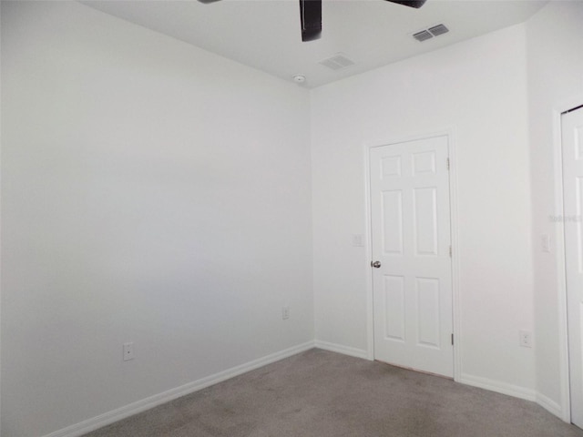 empty room featuring carpet and ceiling fan