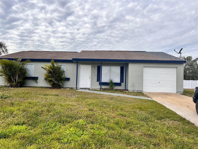 single story home featuring a front yard and a garage