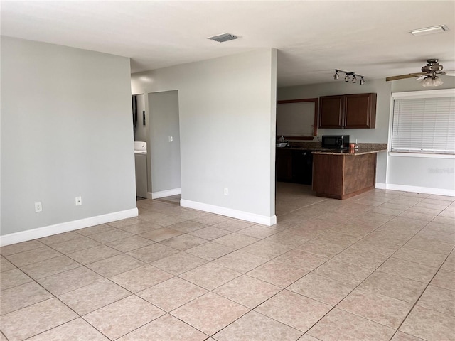 kitchen with ceiling fan, light tile patterned floors, and kitchen peninsula