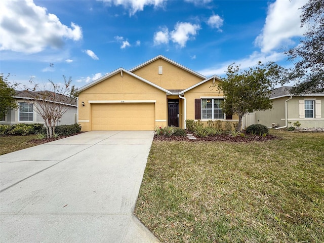 single story home with a front yard and a garage