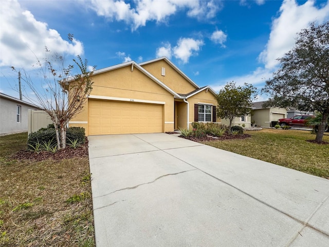 ranch-style home featuring a garage and a front lawn