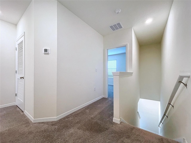 corridor with carpet floors