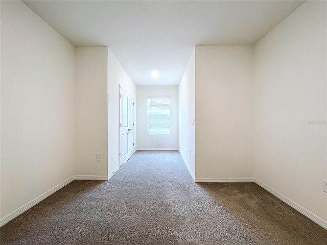 hall with carpet flooring