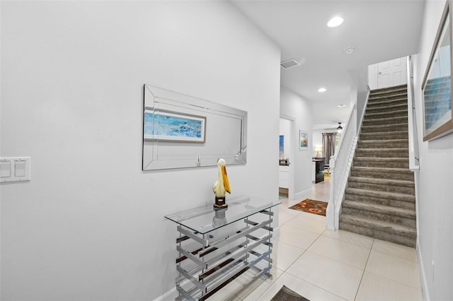 entryway with light tile patterned floors