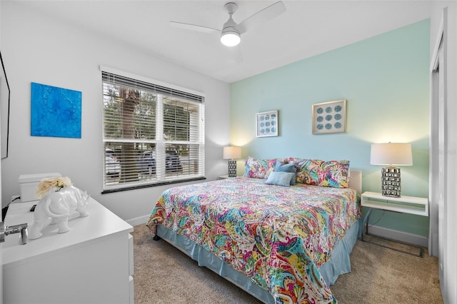 carpeted bedroom featuring ceiling fan