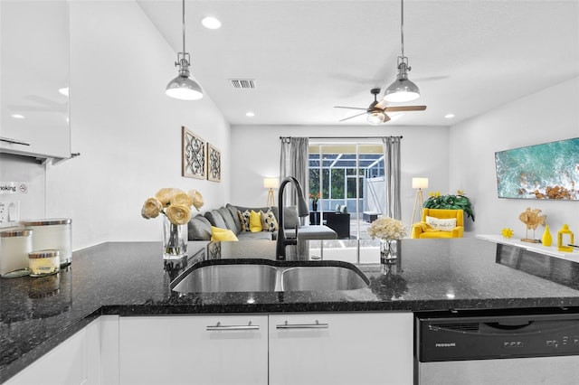 kitchen with white cabinetry, dishwasher, sink, and hanging light fixtures