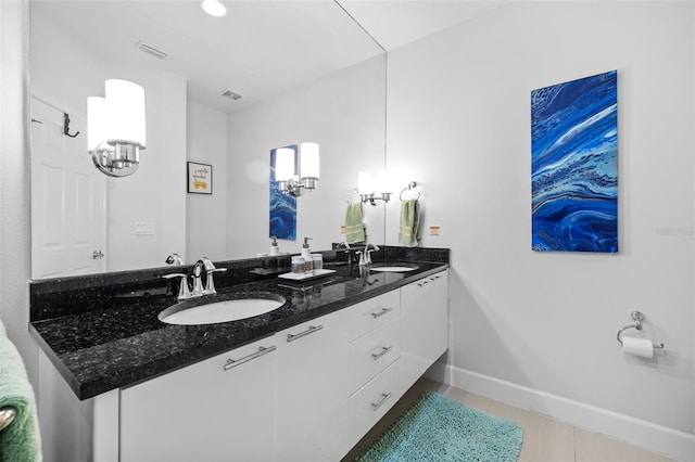 bathroom with tile patterned flooring and vanity