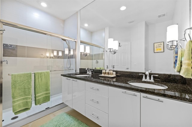 bathroom with vanity and an enclosed shower