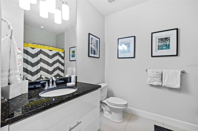 bathroom with tile patterned flooring, vanity, a shower with curtain, and toilet