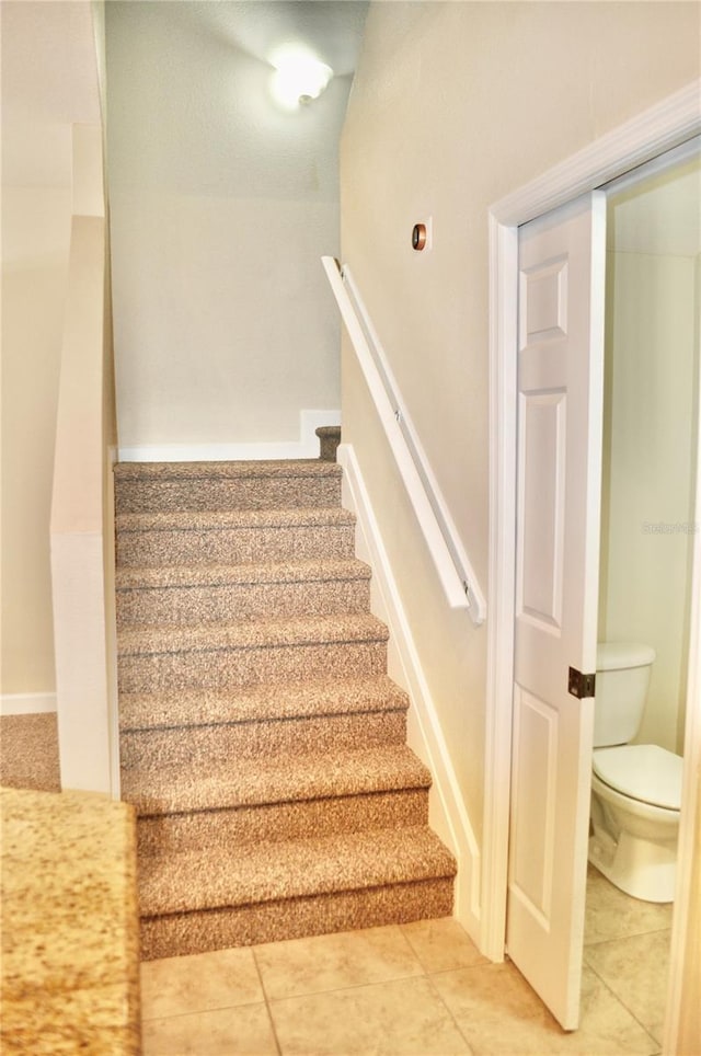 staircase with tile patterned flooring