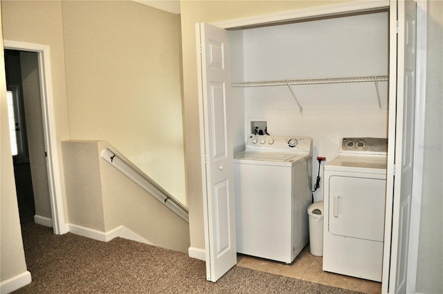 laundry room with light carpet and washing machine and clothes dryer