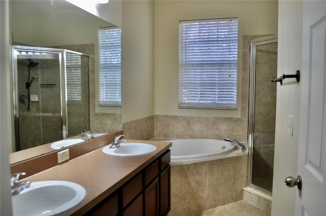 bathroom with vanity, tile patterned floors, and plus walk in shower