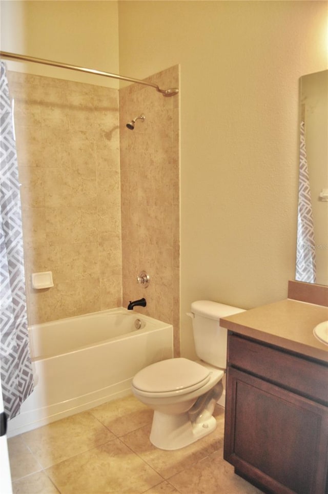 full bathroom featuring tile patterned flooring, toilet, vanity, and shower / tub combo with curtain