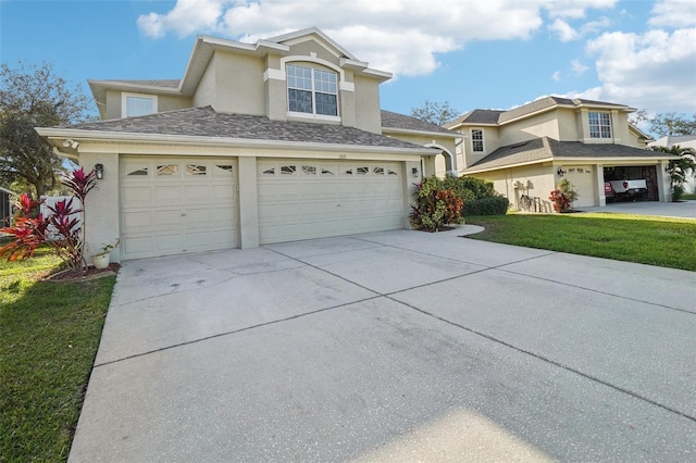 view of front of home featuring a front yard and a garage