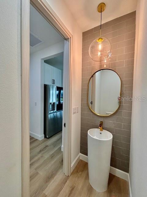 bathroom with hardwood / wood-style flooring