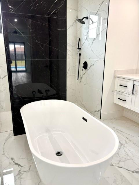 bathroom featuring tile walls and plus walk in shower