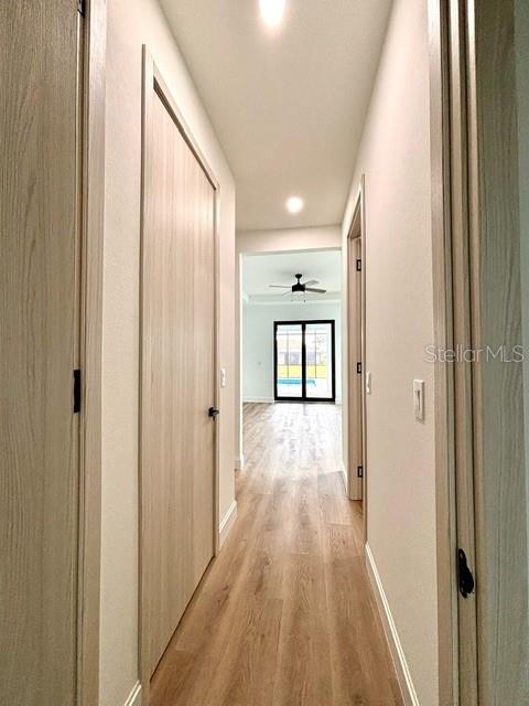 corridor featuring light hardwood / wood-style floors