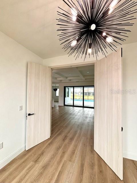 corridor featuring hardwood / wood-style floors