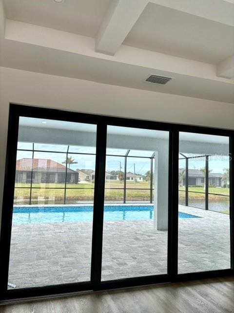 doorway to outside with wood-type flooring and plenty of natural light