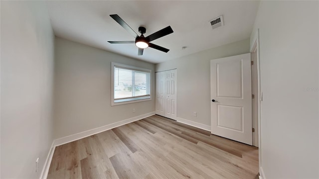 unfurnished bedroom with a closet, ceiling fan, and light hardwood / wood-style floors