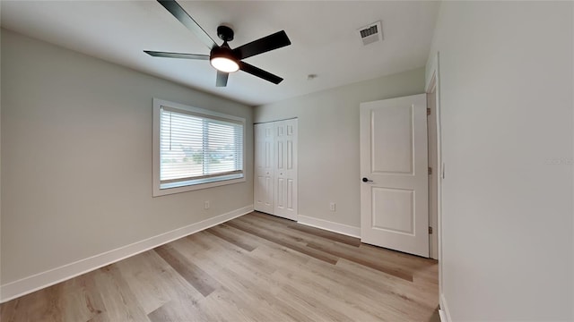 unfurnished bedroom featuring ceiling fan and light wood-type flooring