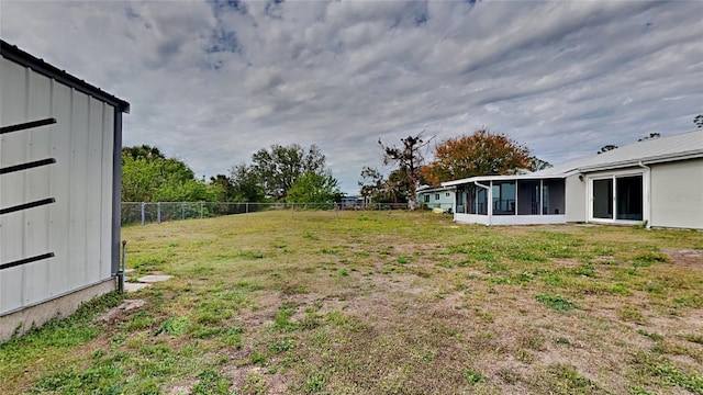 view of yard featuring a sunroom