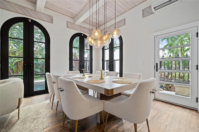 dining area with a healthy amount of sunlight, french doors, wooden ceiling, and beamed ceiling