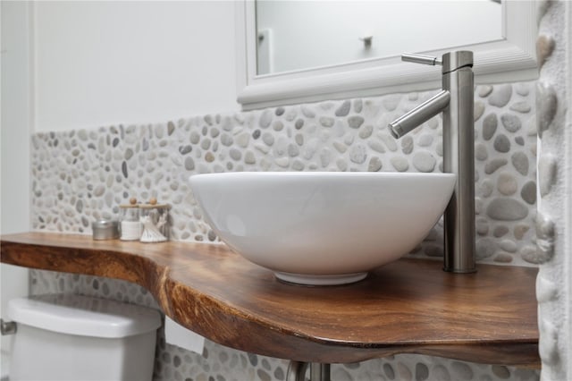 interior details with backsplash and sink