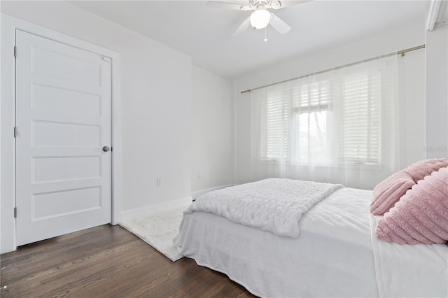 bedroom featuring ceiling fan and dark wood-type flooring